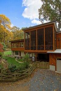 cabin-like home remodel with massive sunroom space