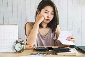 frustrated woman - remodel taking a long time and going over budget